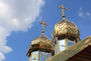 Crosses affixed to the domes of an Orthodox Church.