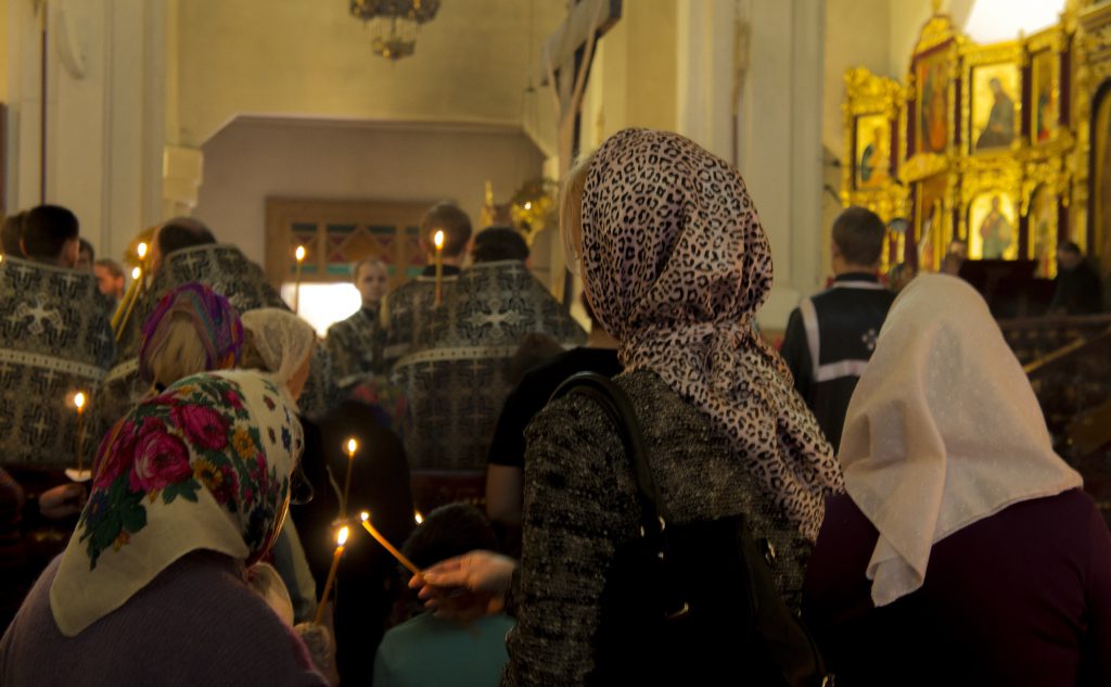 Congregation gathering for prayer in an Orthodox church.