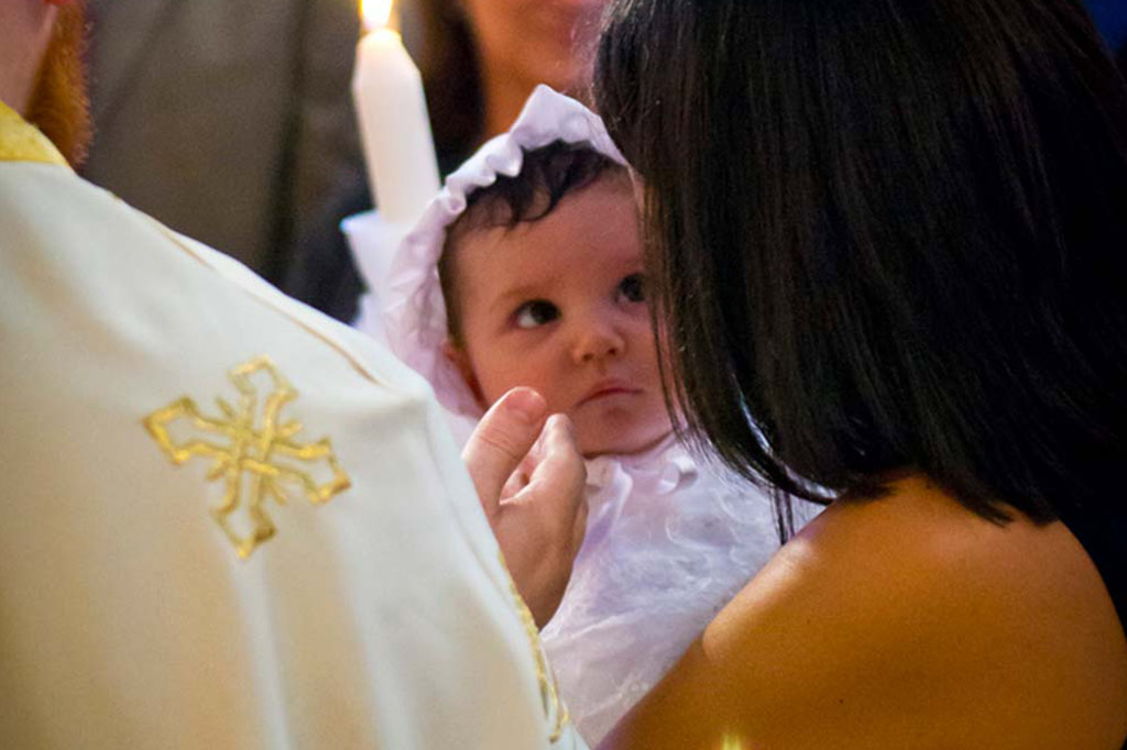 Infant child being churched with her mother